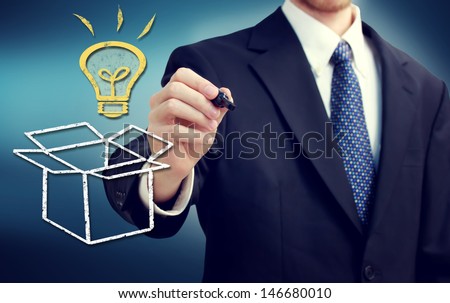 Businessman drawing thinking outside the box theme