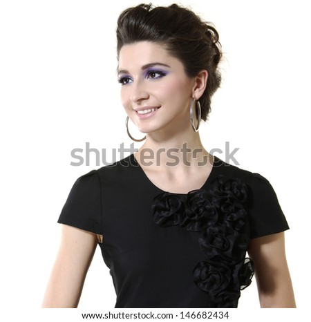 portrait of beautiful stylish girl in black dress posing