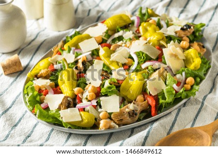 Homemade Mediterranean Pizzeria Salad with Peppers and Artichoke Royalty-Free Stock Photo #1466849612