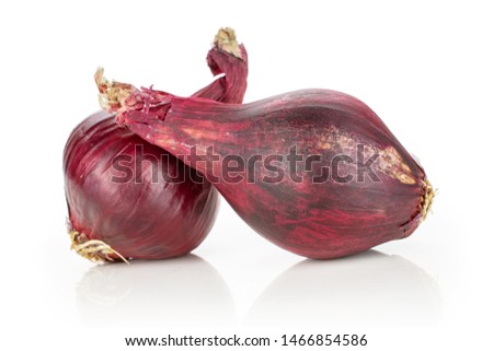 Group of two whole stale red onion isolated on white background