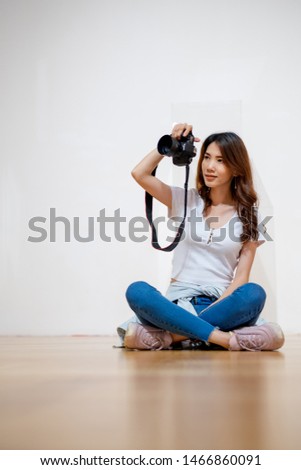 Beautiful woman photographers in the hand have a camera And scenes in various angles