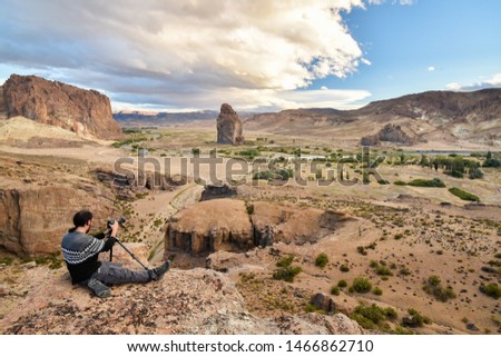 Man taking pictures in the desert of patagonia