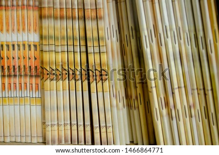 Couple of yellow books making beautiful and interesting abstract art. Books in the wooden classroom waiting to be taken and read. - Nica, Latvia