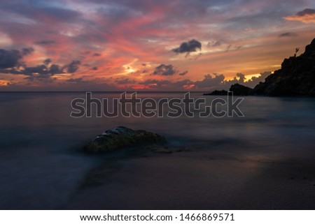 Travel photo of St. Barth’s Island (St. Bart’s Island), Caribbean. View of a peaceful sunset and waves on Shell Beach.