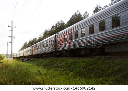 Red-gray passenger long-distance train close-up. Russian Railways. Royalty-Free Stock Photo #1466902142
