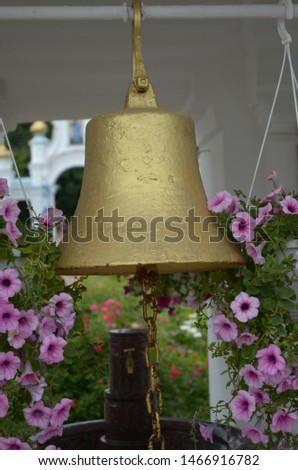 Picture of a ancient epic copper bell hanging in the temple
