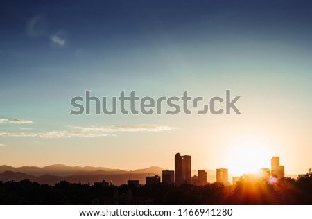 A silhouette shot of Denver's skyline at sunset