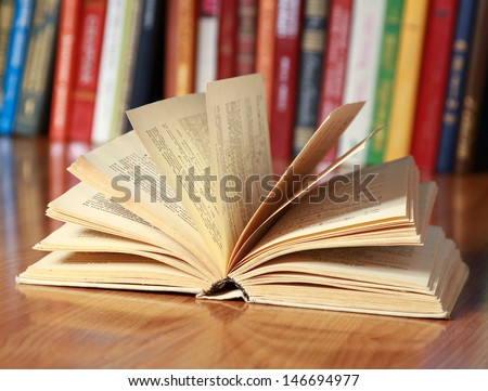 book on the desk against books Royalty-Free Stock Photo #146694977