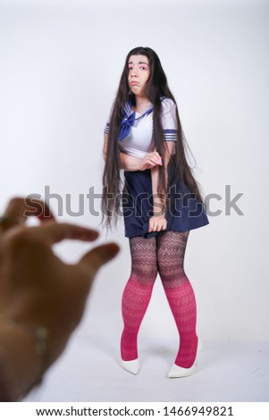 scared girl in school anime uniform on white background
