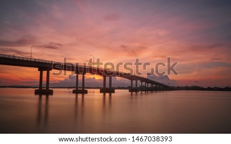 silhouette bridge when sunrise with twilight sky