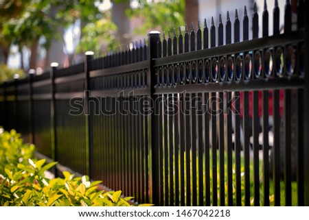 Black Aluminum Fence With Decorative Elements Royalty-Free Stock Photo #1467042218