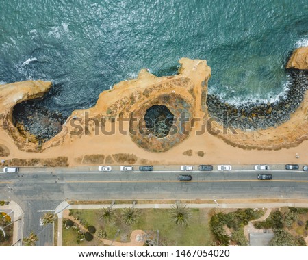 Aerial beach picture with a cave