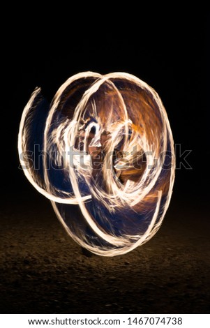 Outdoor fire against a night dard background