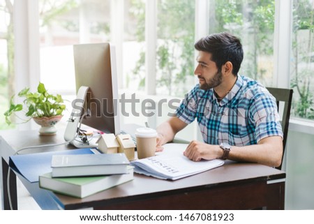 Handsome businessman using computer working at home office, Business working from home concept.
