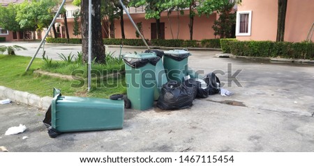 Plastic trash cans to collect garbage, keep clean Royalty-Free Stock Photo #1467115454