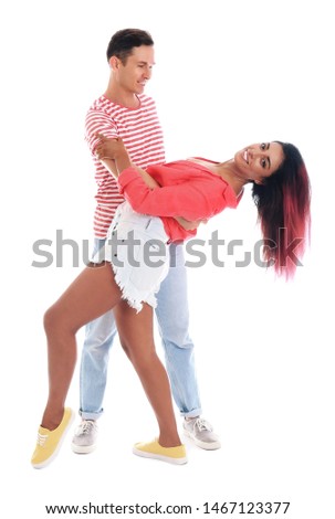 Beautiful lovely couple dancing on white background
