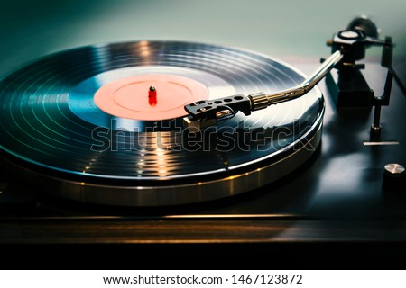 Close-up, vintage record player, While playing the record, Black platter. Royalty-Free Stock Photo #1467123872