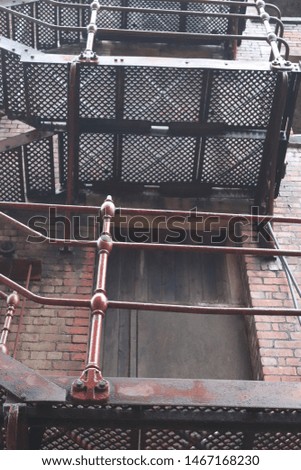 Old metal fire escape on abandoned building