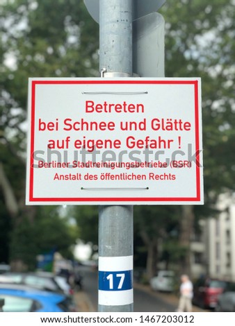
Road sign. Text in german: Enter by snow and ice at your own risk