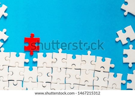 put the red piece of jigsaw puzzle to complete the mission on blue background