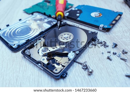 old broken hard disk drives composition in a repair recovery service concept close up selective focus