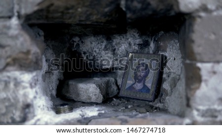 Holy Icon in the rocky wall. Footage. Icon in frame for prayer