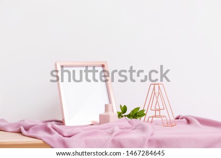 Table with stylish decor on light background
