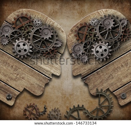 two wooden heads with gears coming into collision concept Royalty-Free Stock Photo #146733134