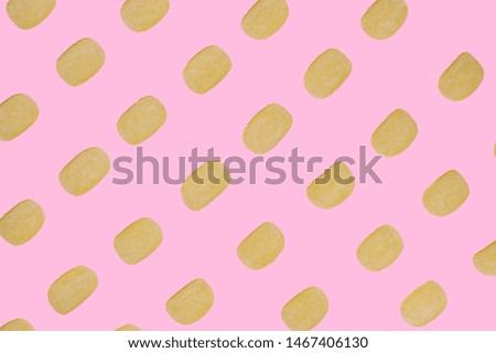 chips on a pink background, top view