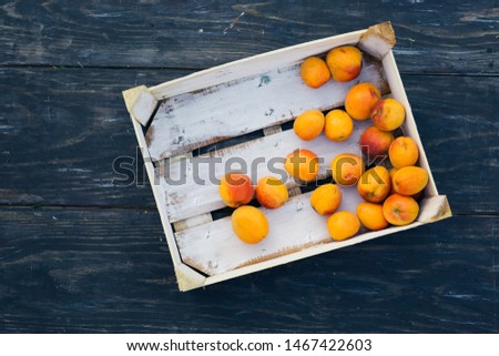 top view of apricot in wooden crate outdoor