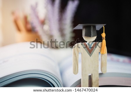 Education knowledge learning study abroad international Ideas. People Sign wood Graduation celebrating cap on textbook in library,Alternative studying distant for learn.Back to School in successful