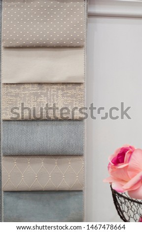 Blue curtains fabric pattern palette texture samples as abstract textile background. Handmade, clothes and furniture decoration concept. Scraps of colored tissue close up