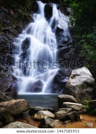 Slow shutter speed shot of a small waterfall called Sai Roong (Rainbow) Waterfall, located in Phang Nga, Thailand