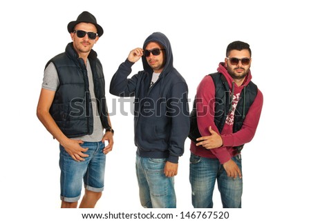 Dancing group of three men with sunglasses isolated on white background