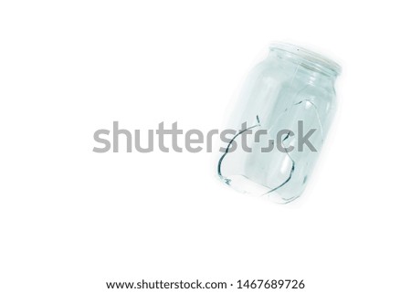 Broken glass jar, broken glass on white background, concept of danger. copy space
