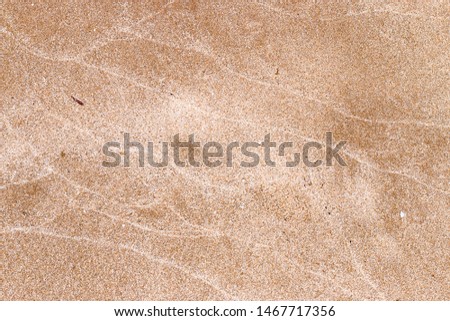 A close up of white sandy beach pattern on Mediterranean seaboard