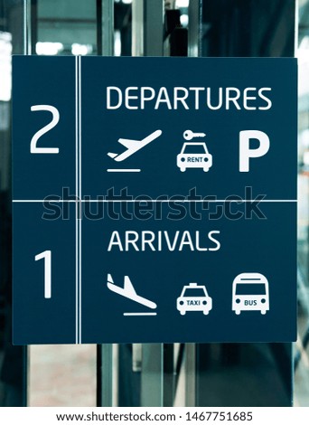 The airport - pointer to the arrivals and departures halls
