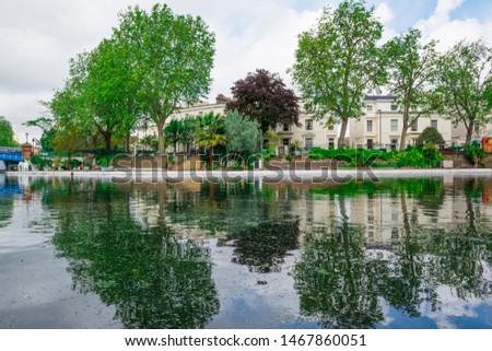 Trees reflected in river at Little Venice in London