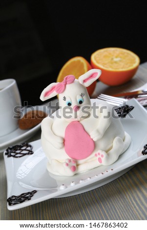Easter cake in the form of a white pink rabbit