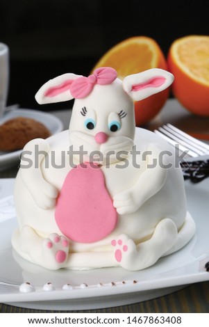 Easter cake in the form of a white pink rabbit