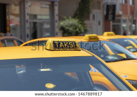 Taxi in Istanbul. Yellow color taxi on cars roof sign.  