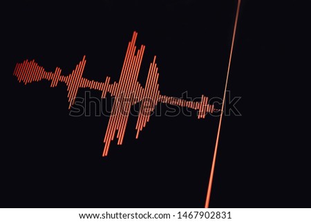 Red sound wave on a black background.