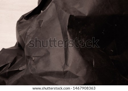 black creased crumpled paper background grunge texture backdrop