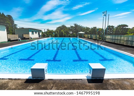 Water shadow.Summer outdoor swimming pool. Royalty-Free Stock Photo #1467995198