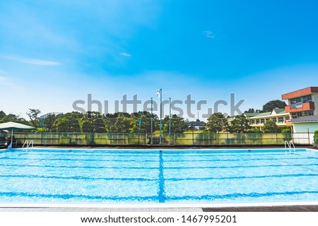 Water shadow.Summer outdoor swimming pool. Royalty-Free Stock Photo #1467995201