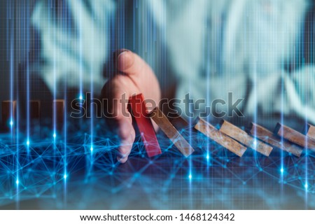 business disruption ideas concept man hand stop falling down of wood block with digital infographic double exposure  Royalty-Free Stock Photo #1468124342