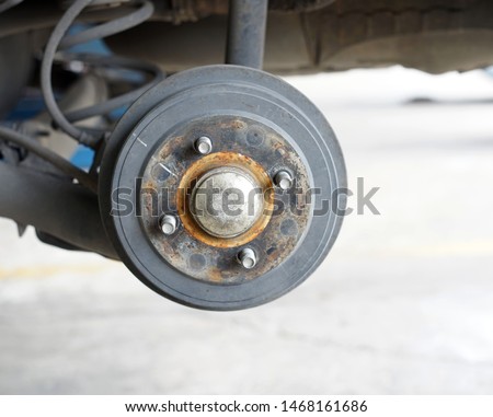 A rear left wheel axle of the car.