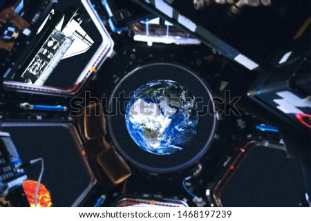 View of space shuttle and Earth planet of Solar system from space station. Outer space. Elements of this image furnished by NASA