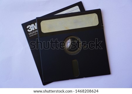 Two 5 1/4-inch Floppy Disk also called 5.25 diskettes, disk isolated with white background, now used as a save icon