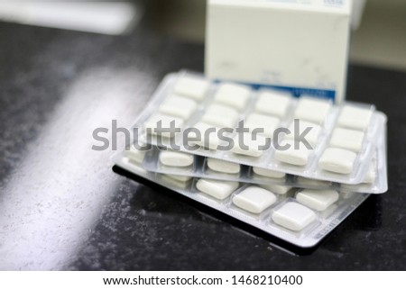 nicotine gum on the table in drug store for stop smoking  Royalty-Free Stock Photo #1468210400